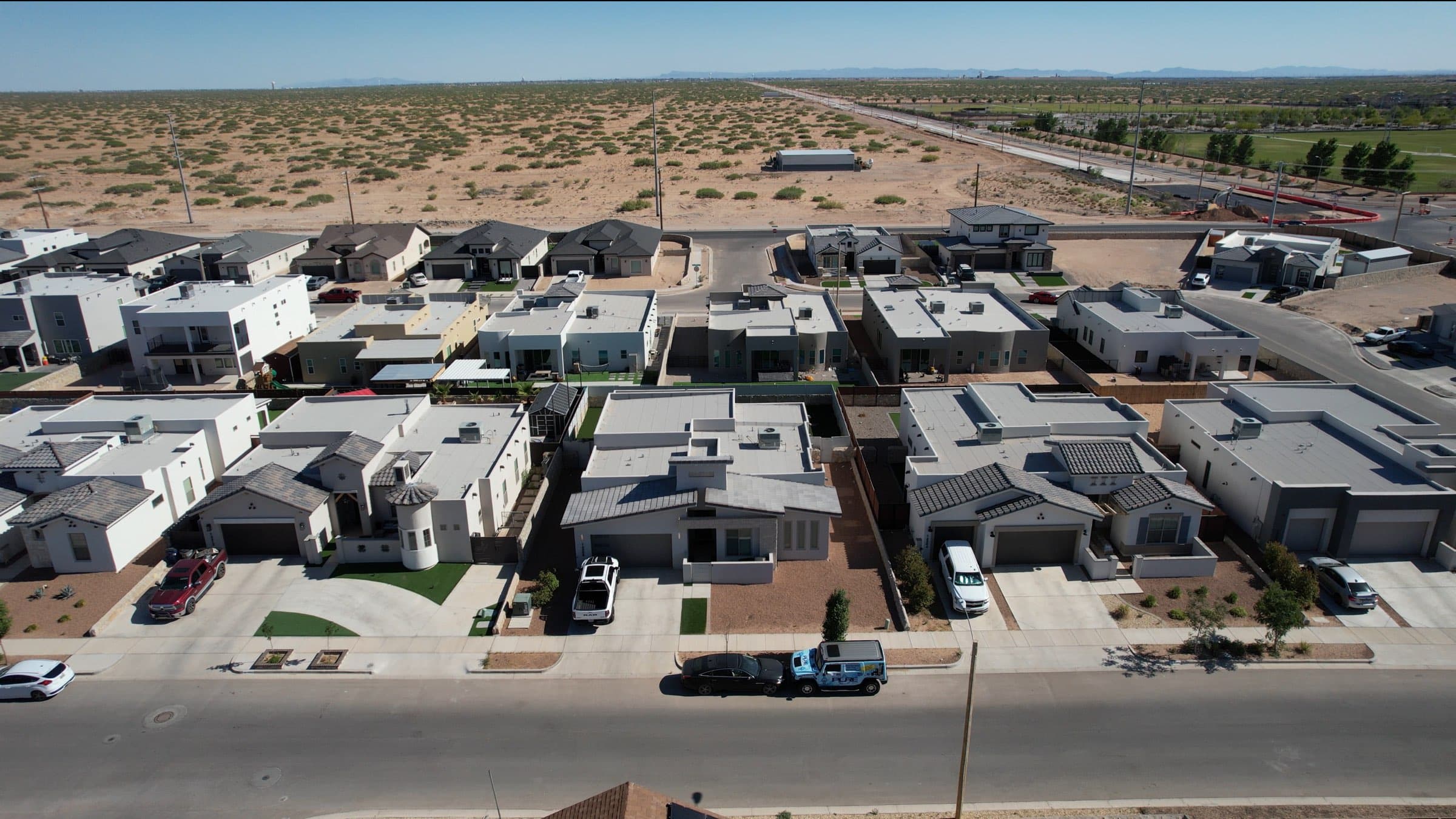 Aerial view of new construction homes at the Far East El Paso development edge