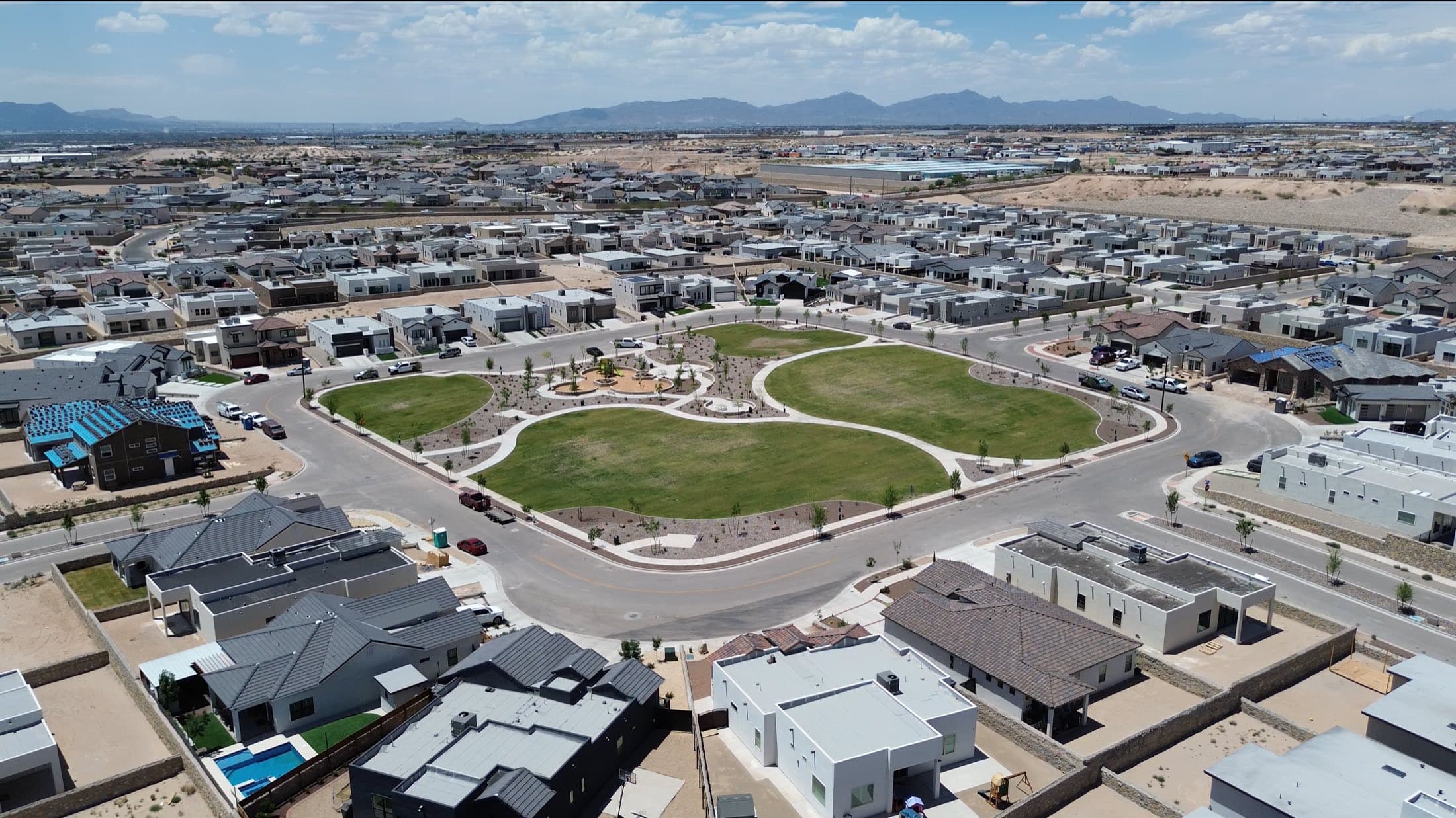 Aerial view of a new Horizon City community built around a central green park