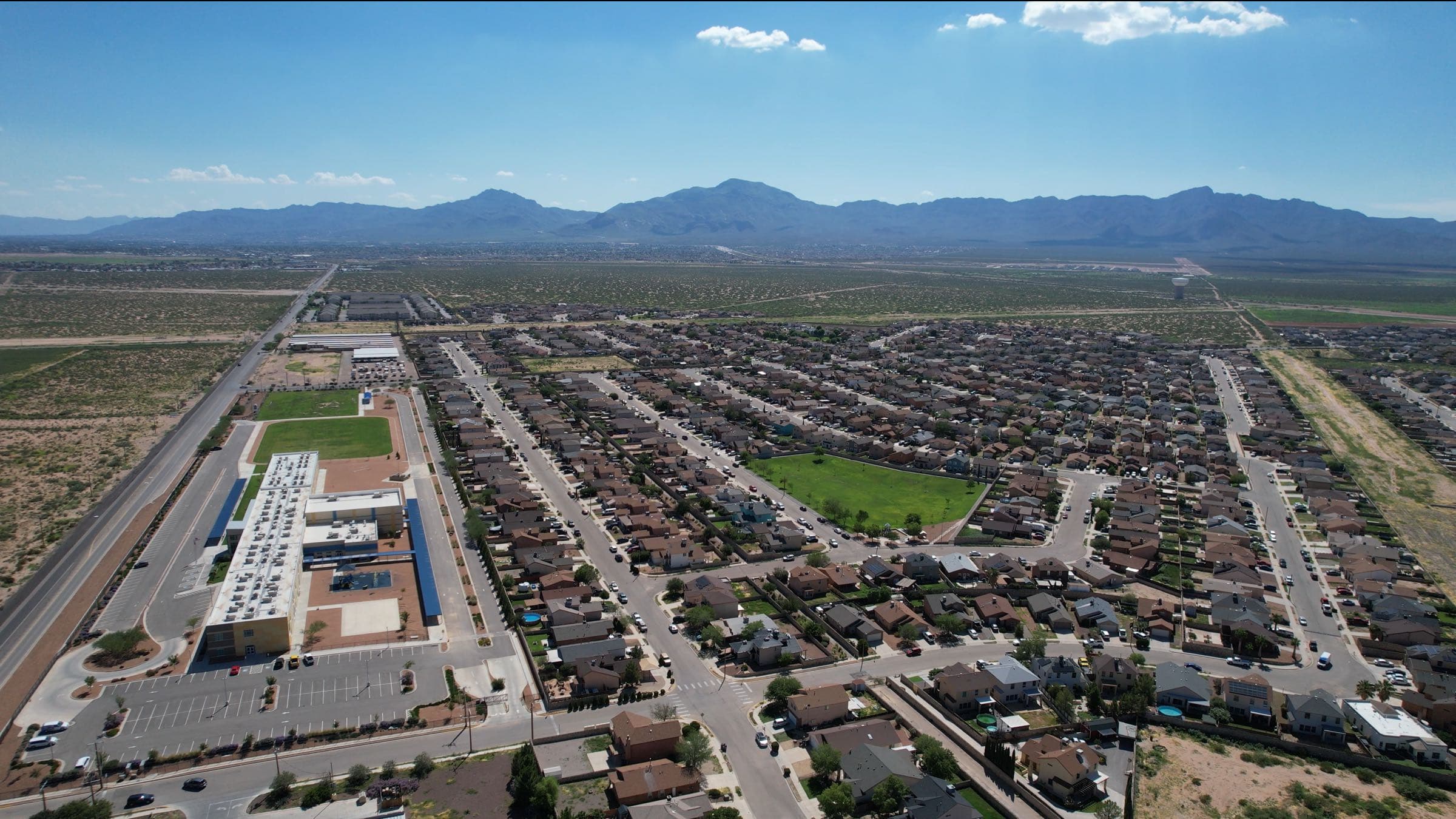 Aerial view of a Northeast El Paso master-planned community with mountain backdrop