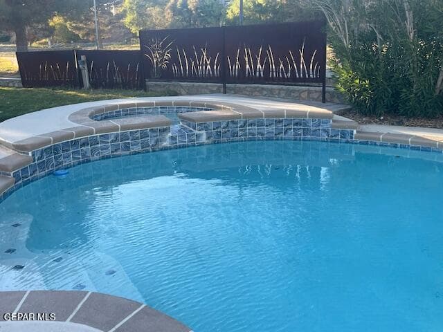 Pool area and hot tub