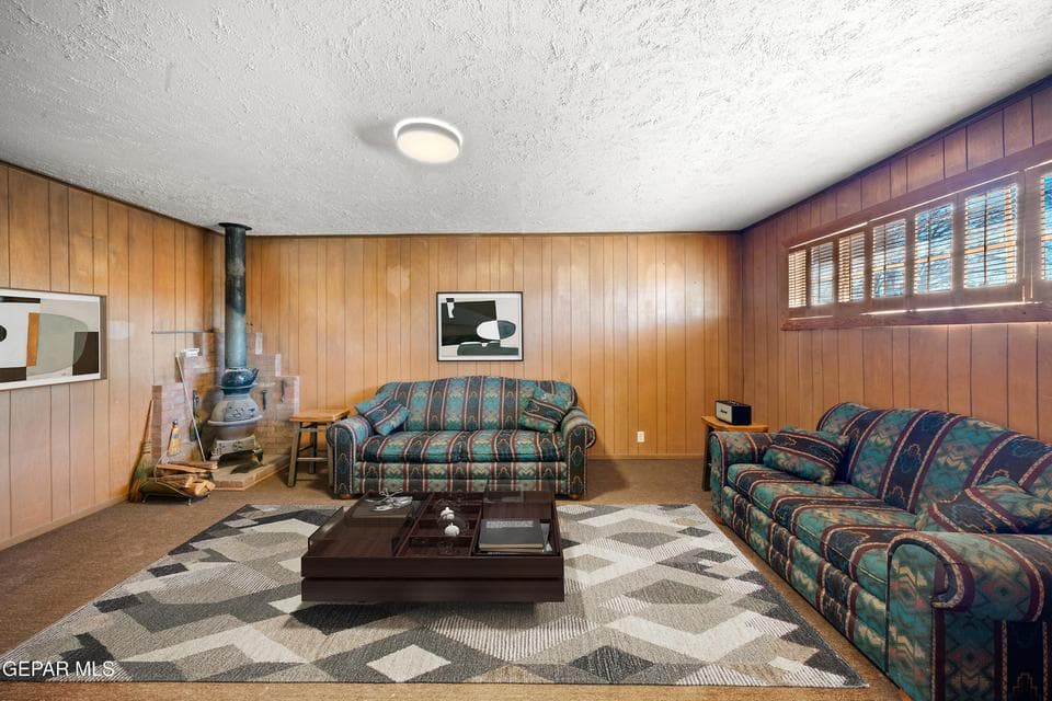 Den with Cast-Iron Wood Burning Fireplace