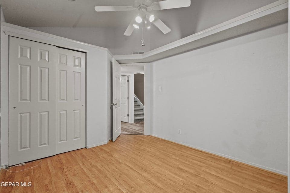 Includes built-in closet, ceiling fan and hardwood flooring.