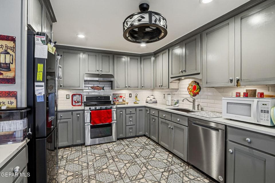 Lovely kitchen soft close feature, pull out trash drawer, undermount engineered black granite sink