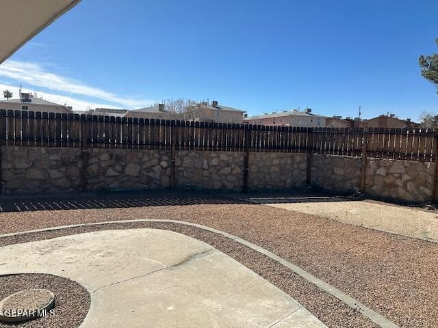 WOODEN FENCE ON TOP OF ROCKWALL, FOR MORE PRIVACY