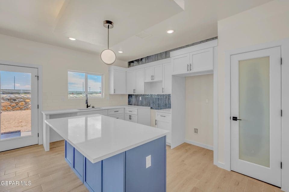 Quartz Countertops & Tray Ceilings with indirect lighting