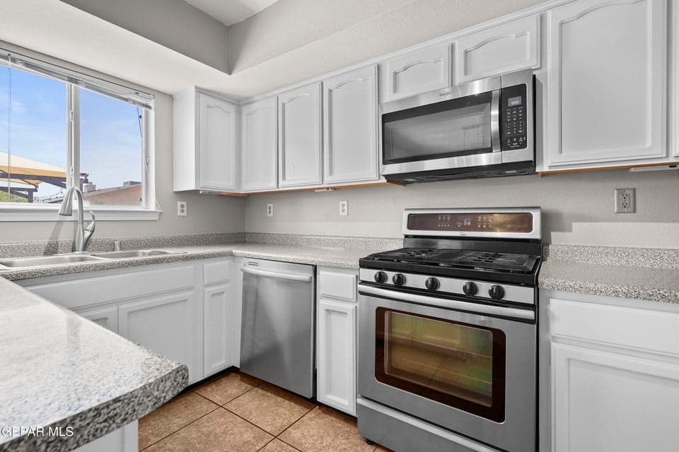 Appliances included, bright kitchen layout, overlooks backyard