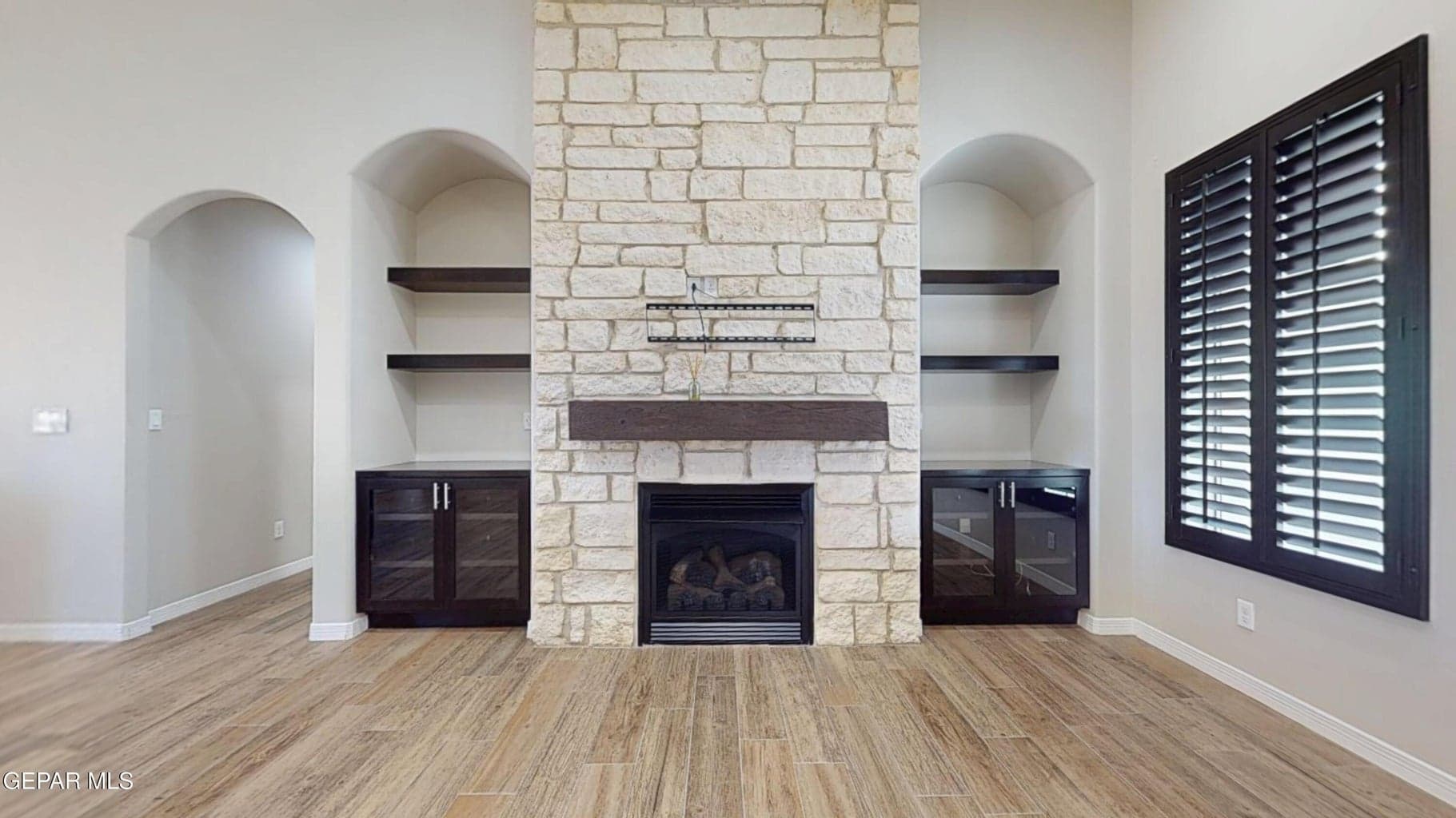 Beautiful fireplace surround with storage.