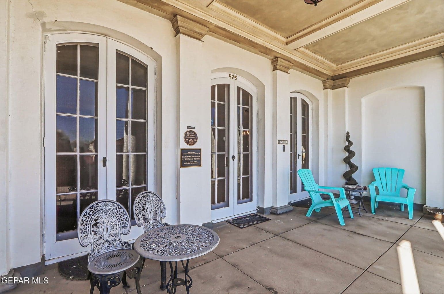 The exterior walls are 17 inch thick, load-bearing brick with a cement plaster finish, designed for energy efficiency.