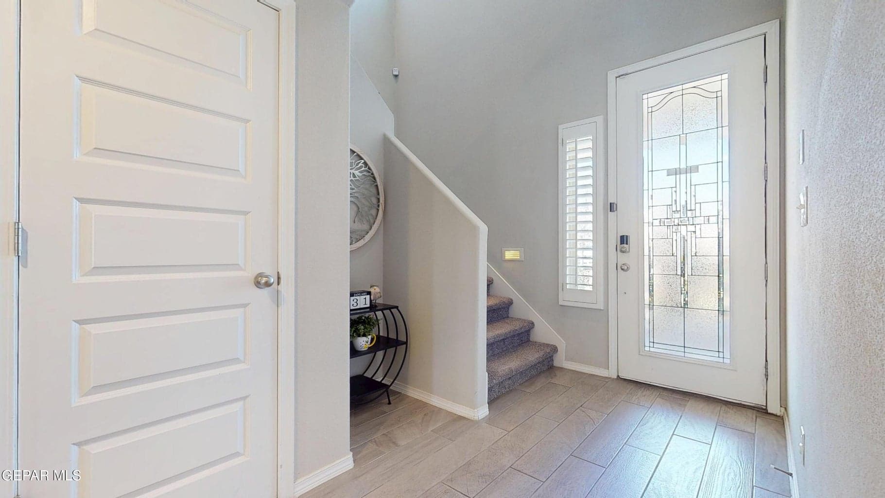 Beautiful well lit entryway.