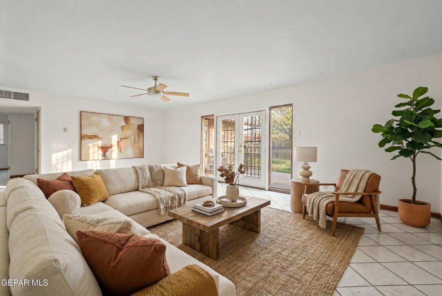 The living room provides a functional space ideal for relaxing or entertaining.