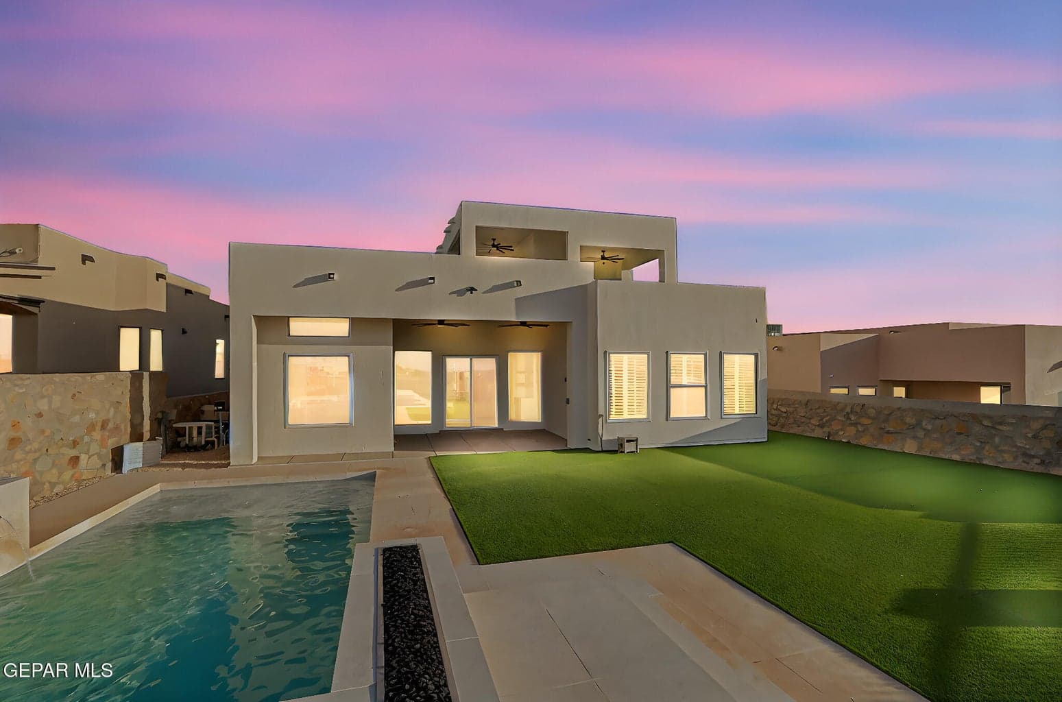 Resort-style pool with sundeck, built-in hot tub spa