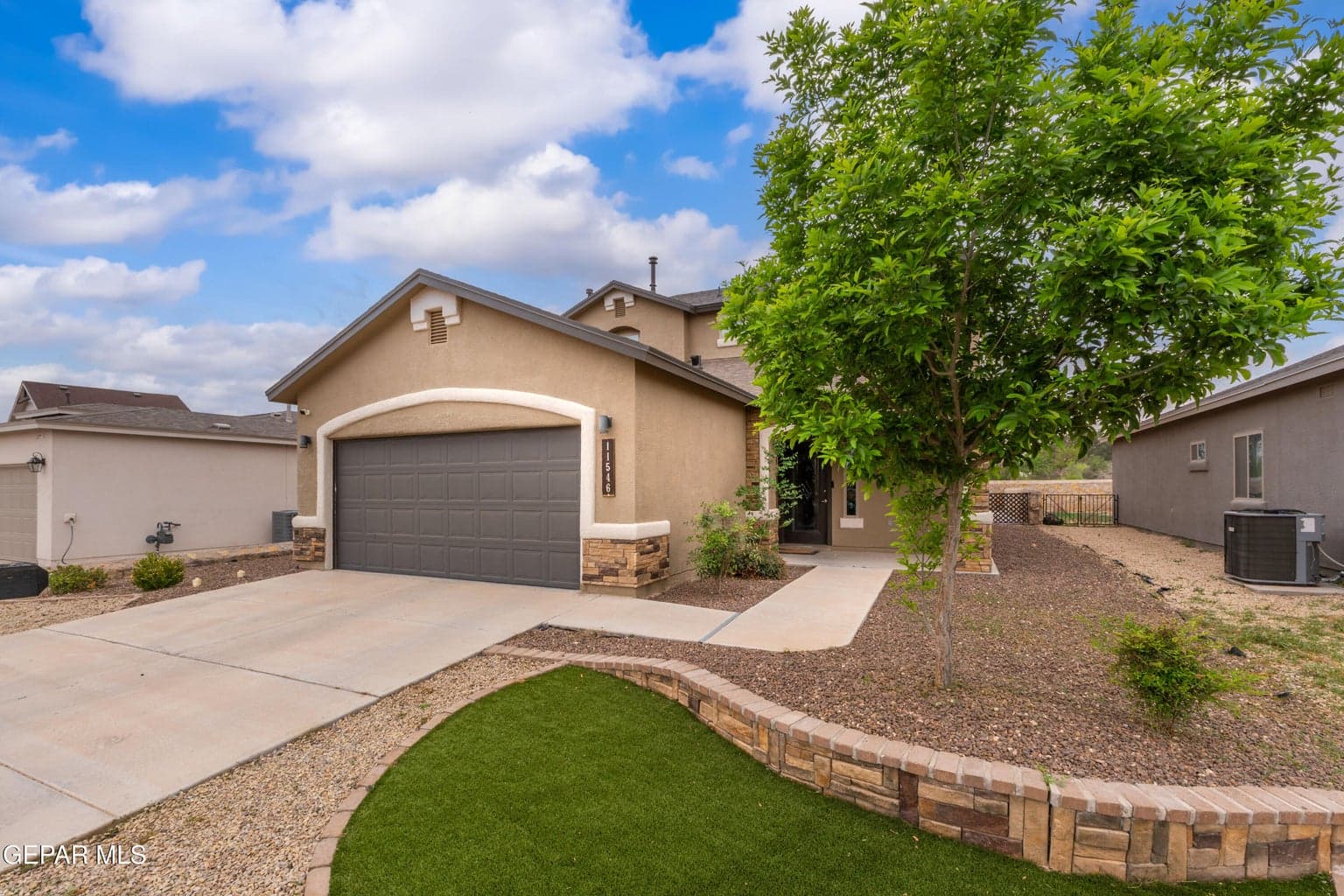 Xeriscape front landscaping giving it a beautiful design and easy maintance.