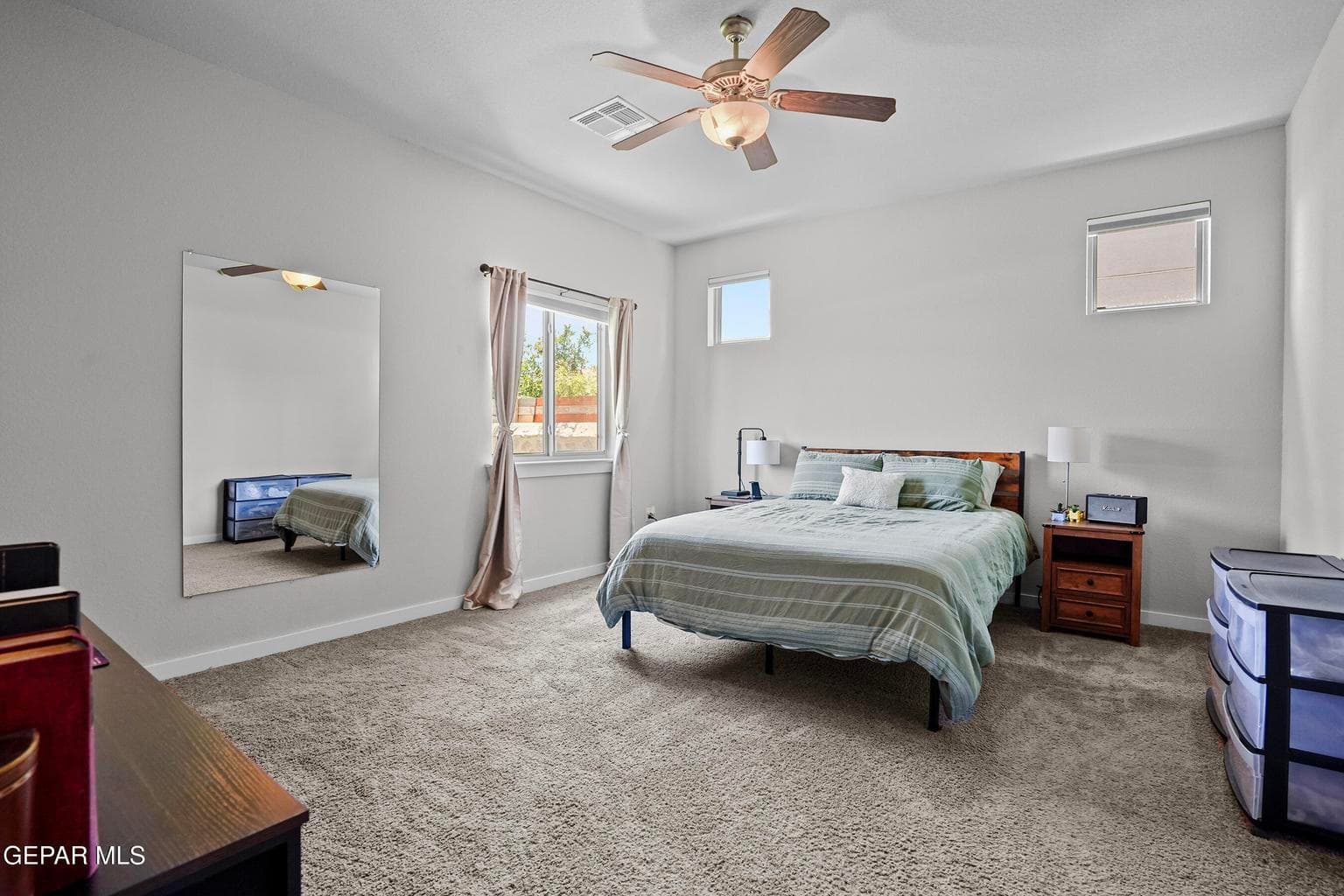 Spacious layout with carpet flooring, ceiling fan for comfort