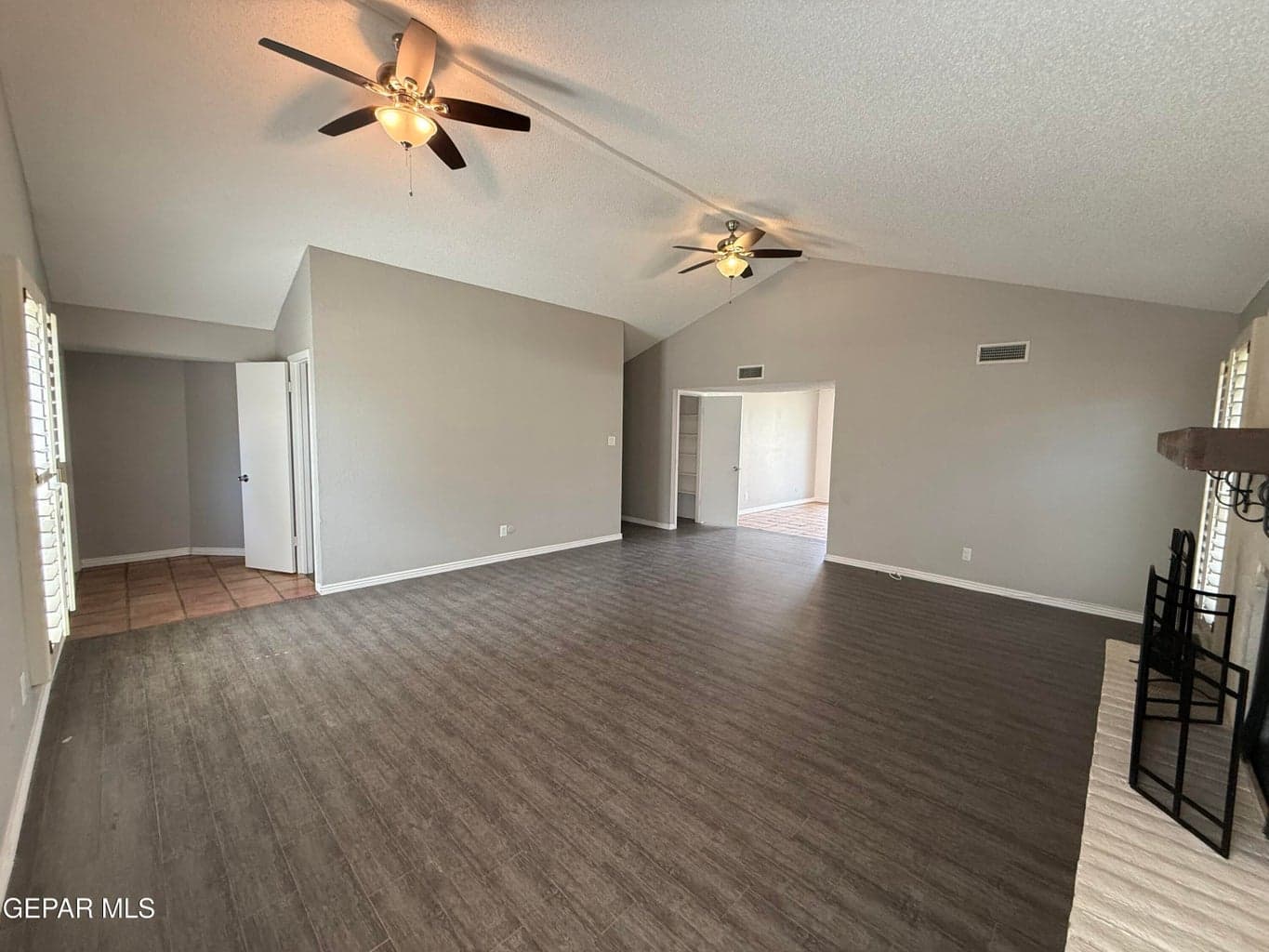 Great room off foyer. Ceiling fans and wood burning fireplace.