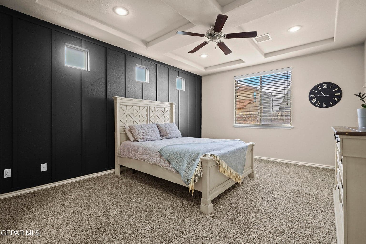 Private main-level retreat, generous floor space, soft carpet flooring, & ceiling fan