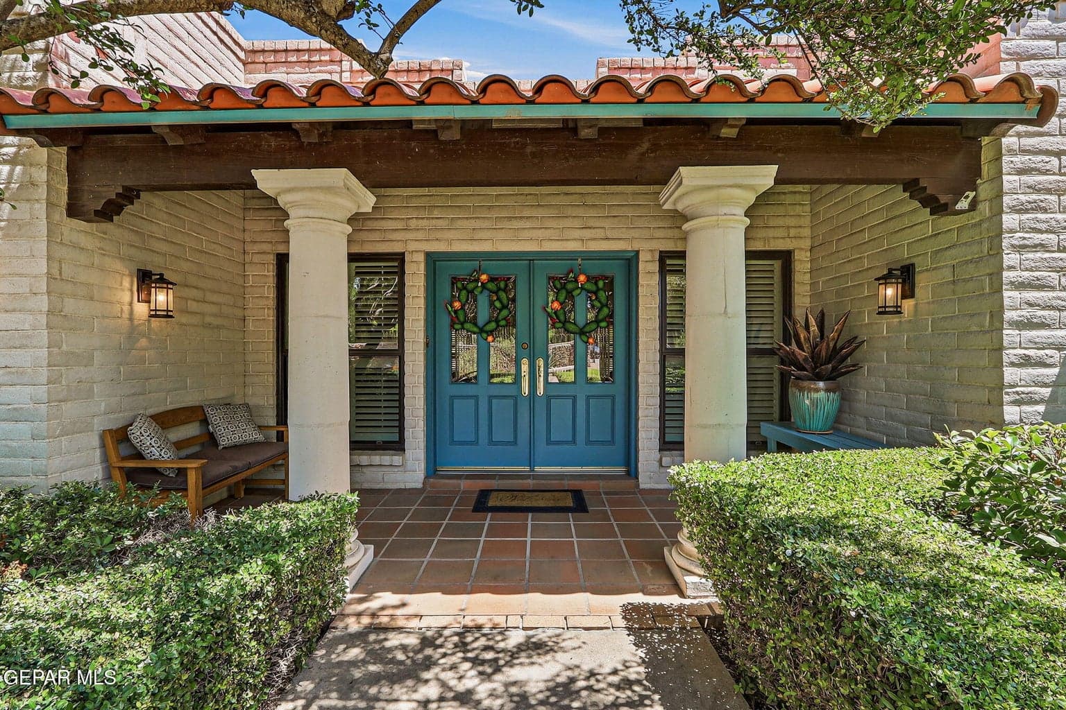 A lovely covered front porch serves as a charming introduction to this beautiful home