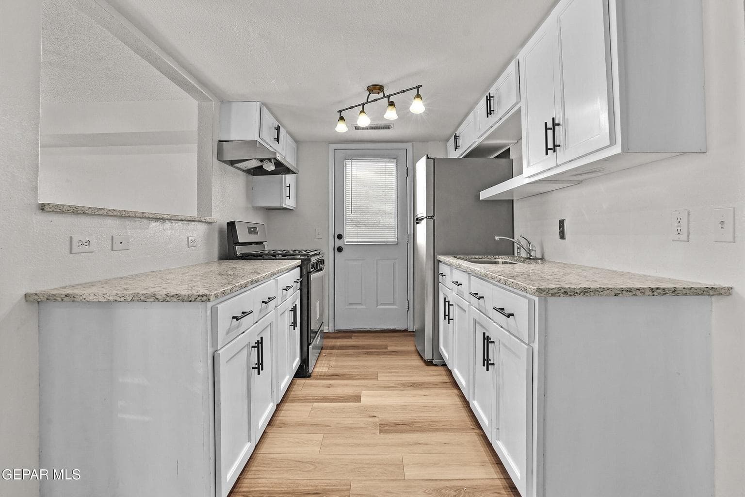 Bright ambiance, granite countertops, upgraded stainless steel appliances