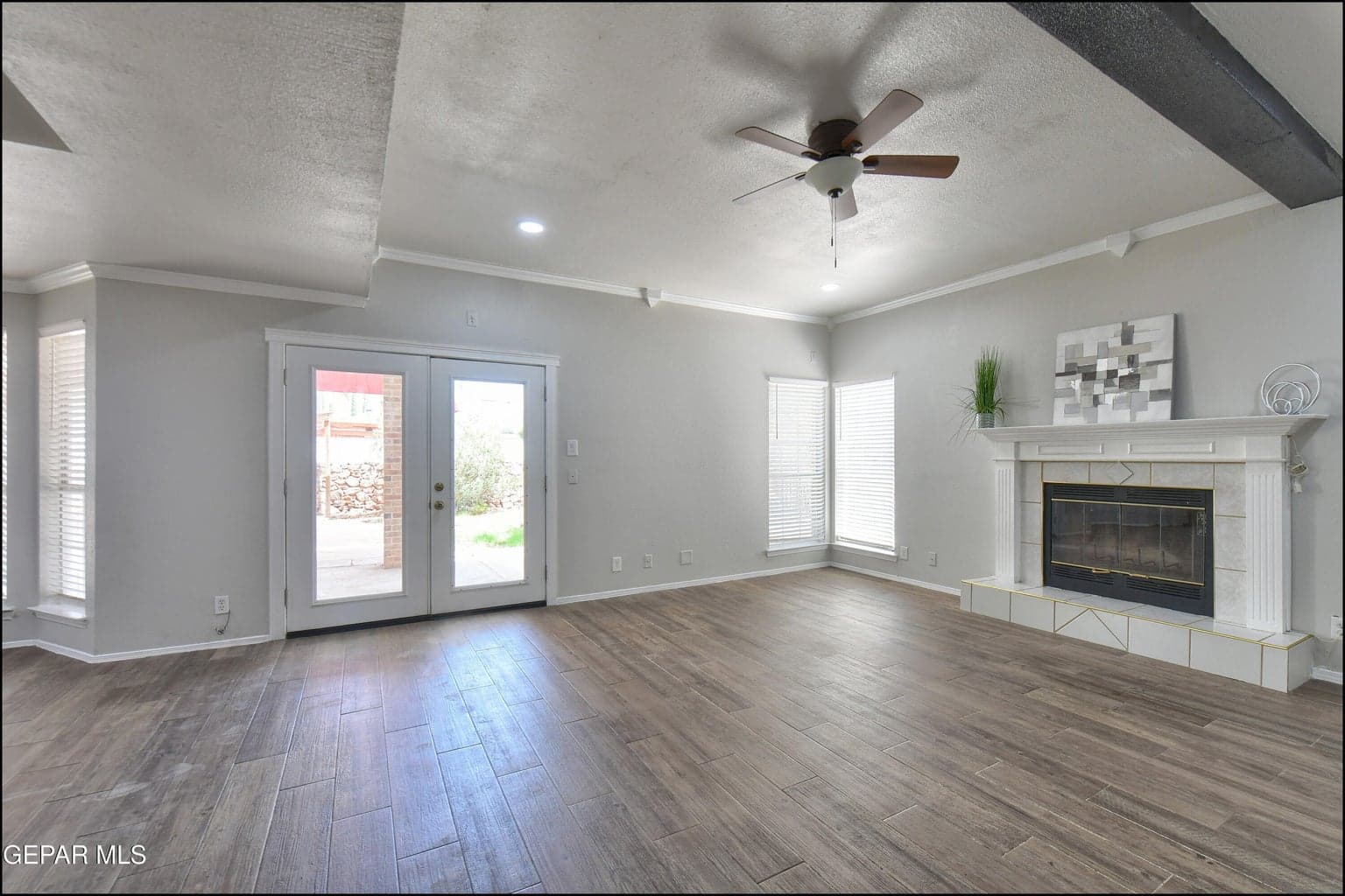 Family rm w/fp and french doors to back yard/patio