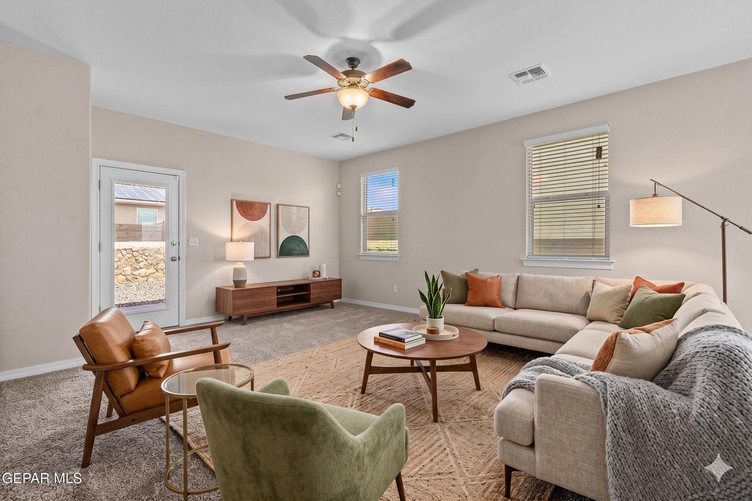 The expansive great room offers comfortable carpet flooring