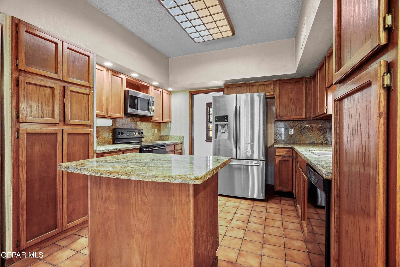 Offers ample cabinetry, granite countertops