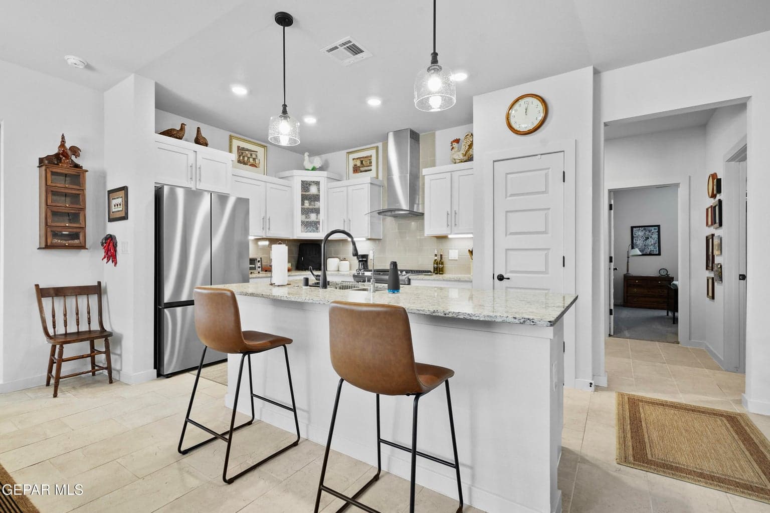 Features granite countertops, ample cabinetry, and stainless steel appliances