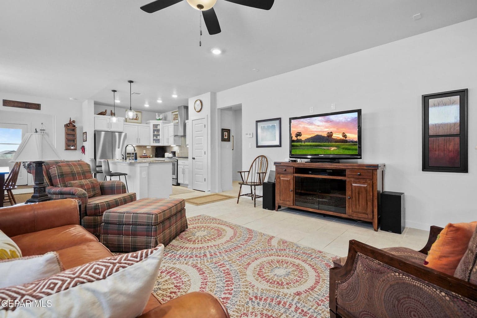 The spacious great room offers a comfortable carpeted design