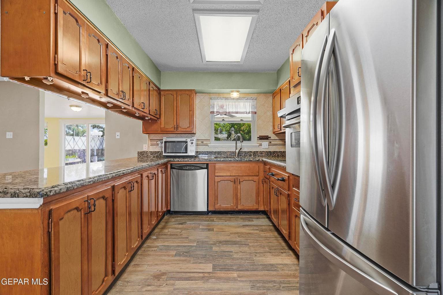 Offers ample cabinetry and stainless steel appliances