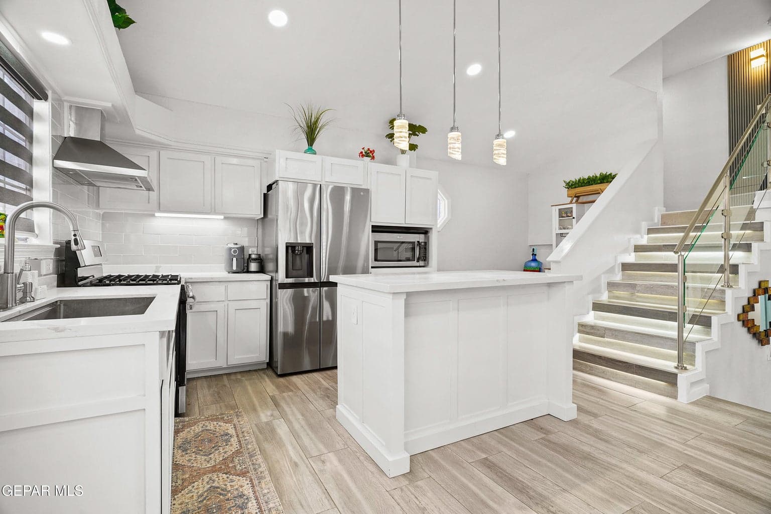 Features quartz countertops and ample cabinetry