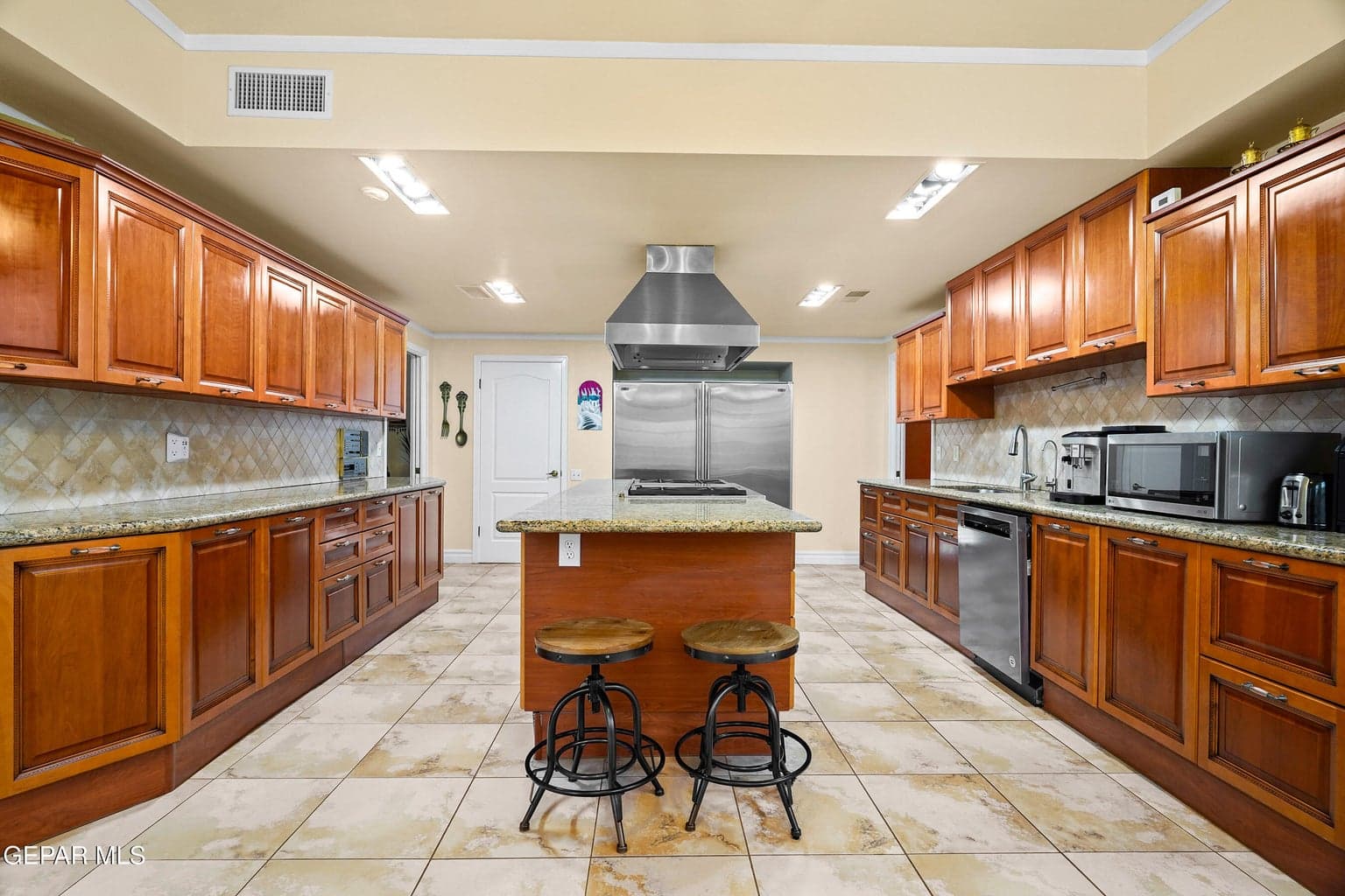 Features abundant cabinetry, generous countertop space, tile flooring
