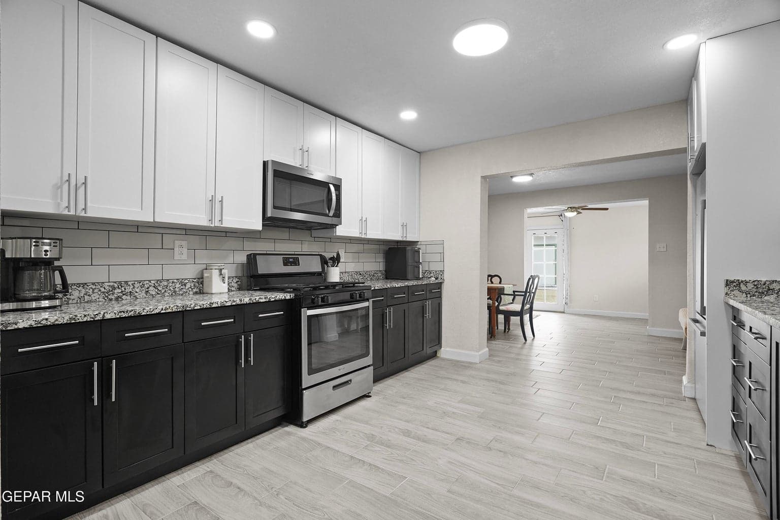 Fresh kitchen features granite countertops