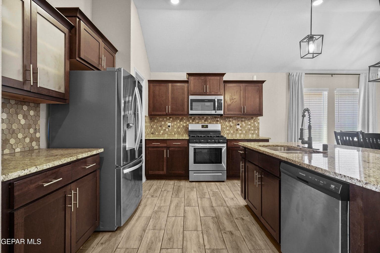 Enjoy granite countertops and ample cabinetry