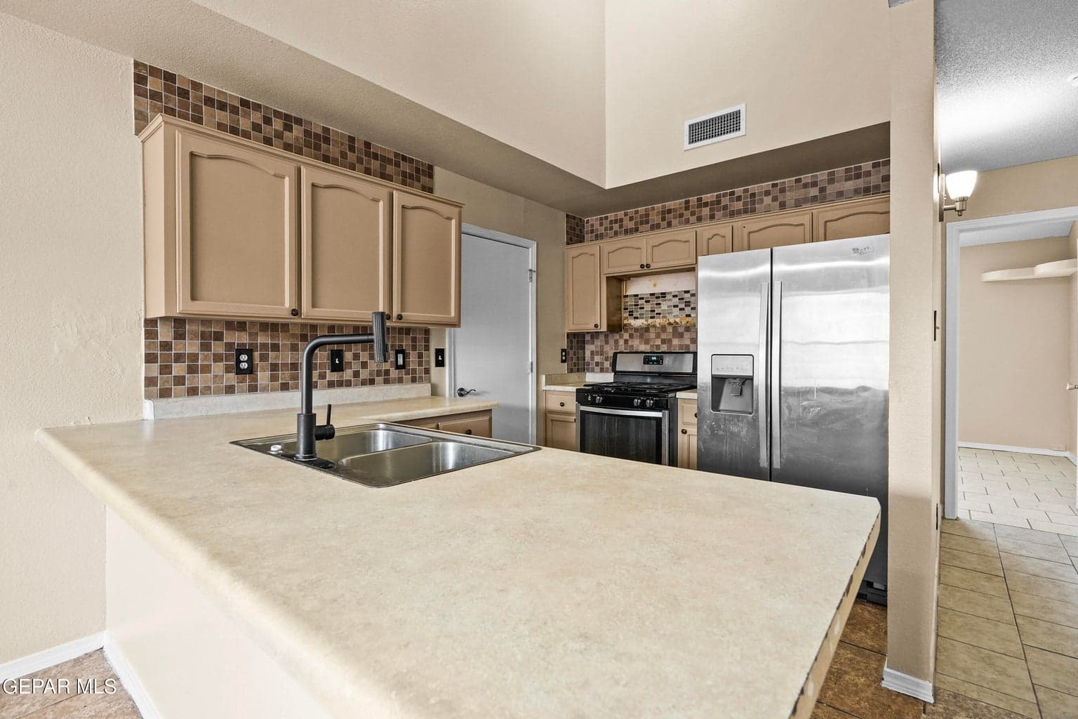 Upgraded appliance package and backsplash and new faucet