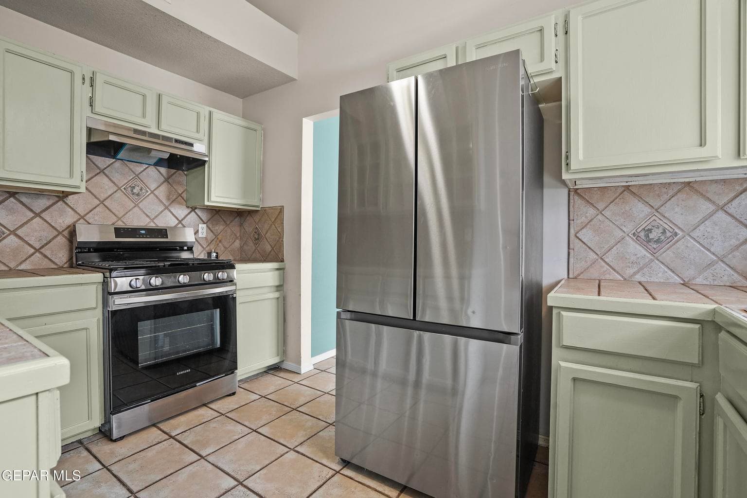 The kitchen provides practical workspace for cooking and meal preparation.