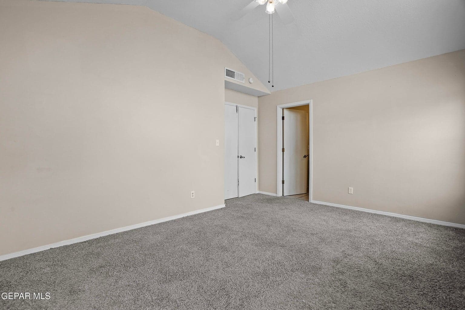 Spacious primary bedroom offering a relaxing retreat.