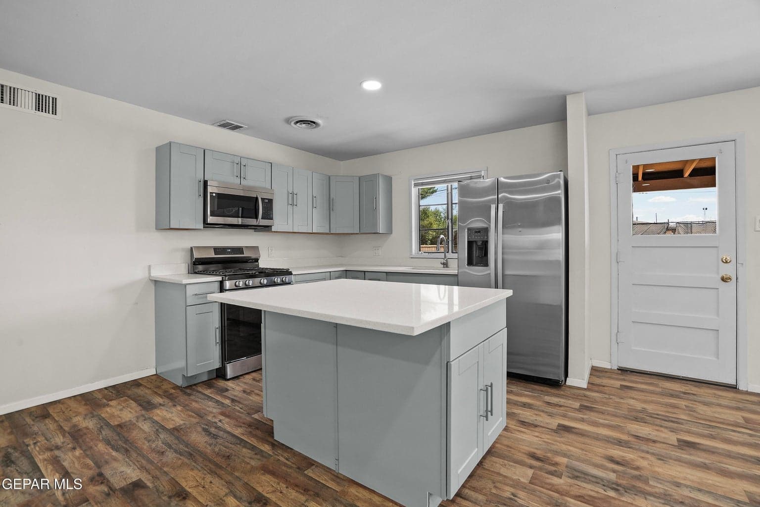 Features brand-new cabinetry and sleek quartz countertops