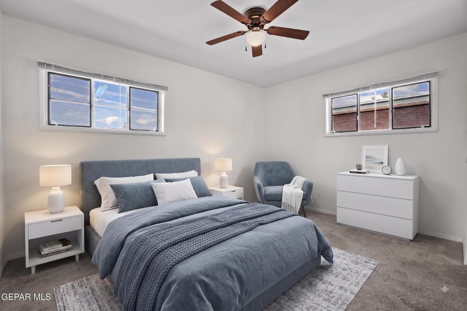 Features carpet flooring, a ceiling fan, a closet