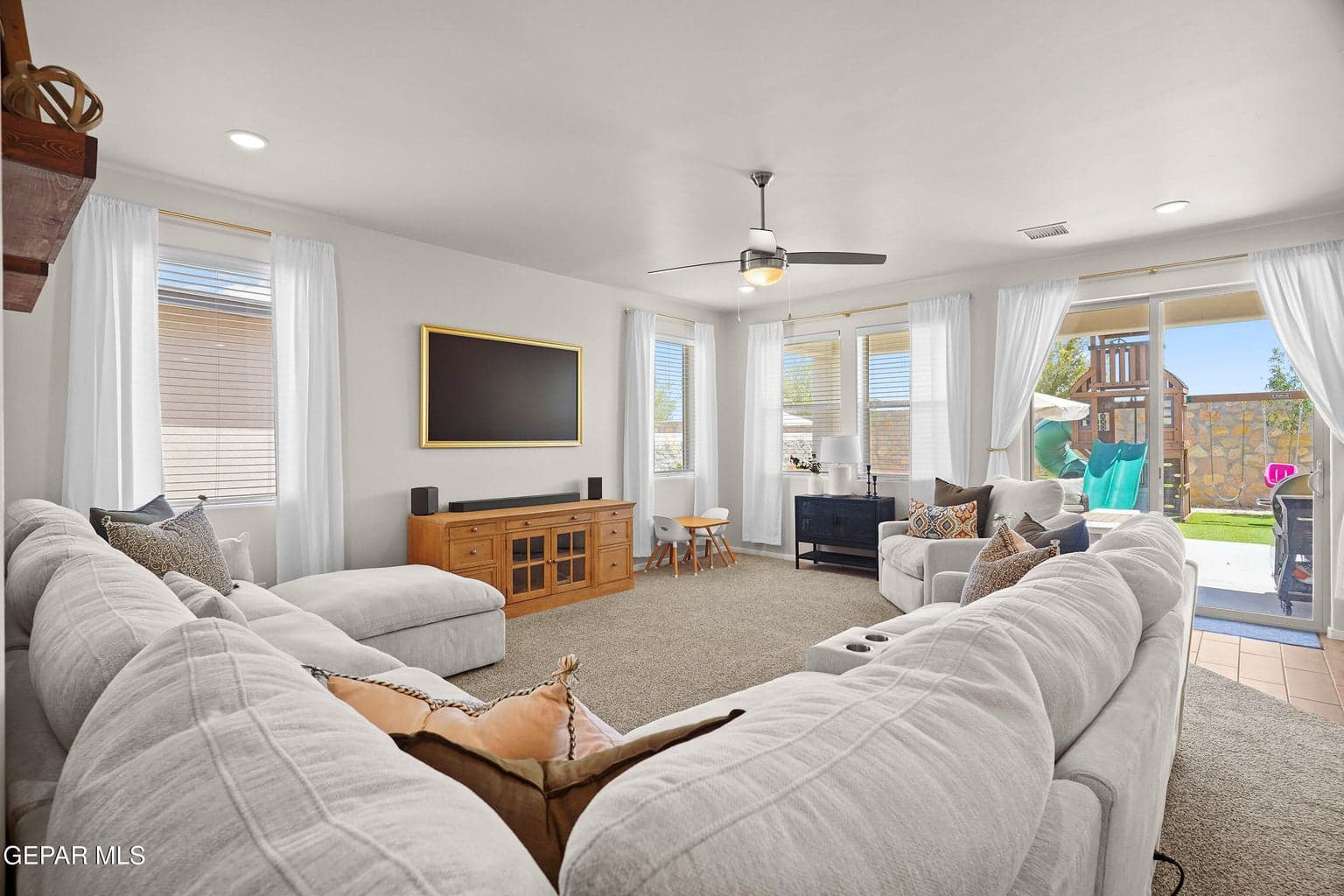 The bright great room offers plenty of space for relaxing and entertaining