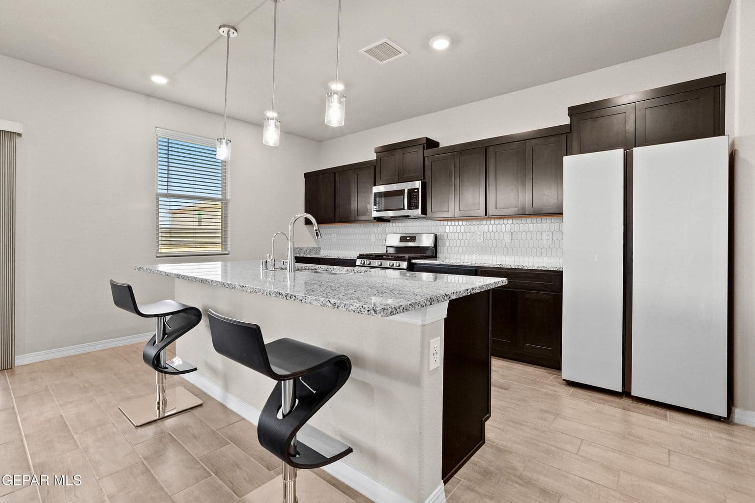 Upgraded backsplash, granite counters, upgraded cabinetry & refrigerator! Schedule your showing today!