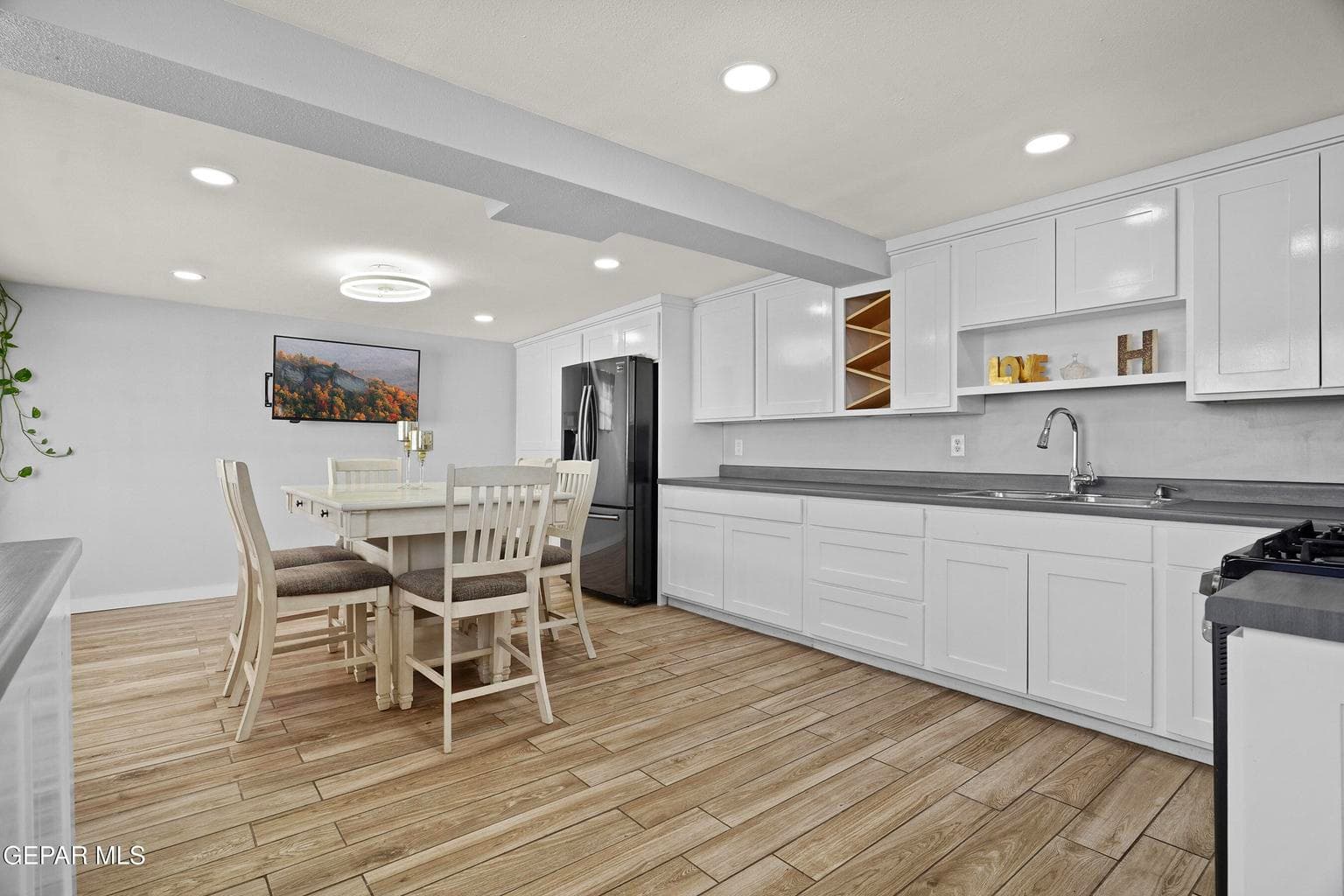 The open-concept kitchen has been completely updated for modern living.