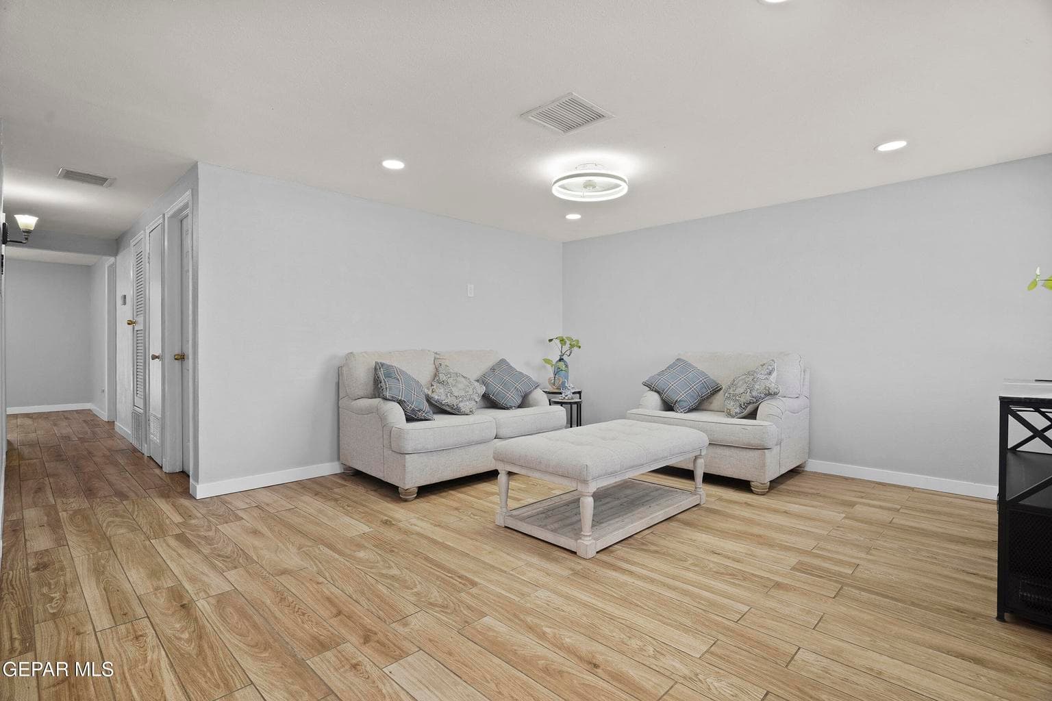 The generous great room offers plenty of space for relaxing and entertaining.