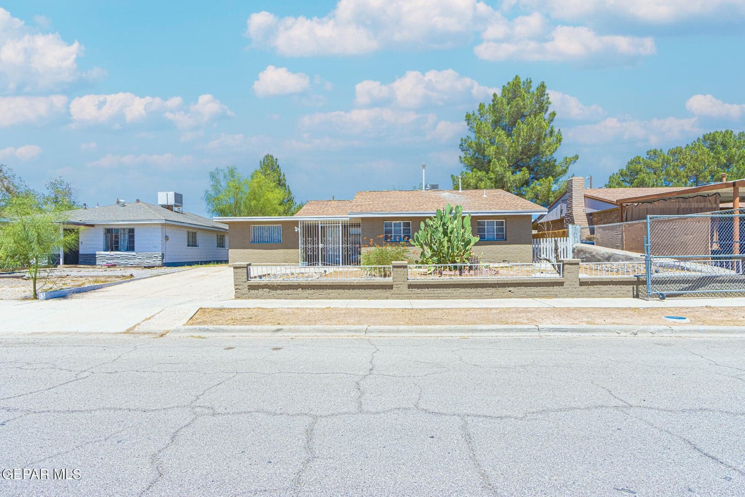Spacious front exterior with ample driveway parking