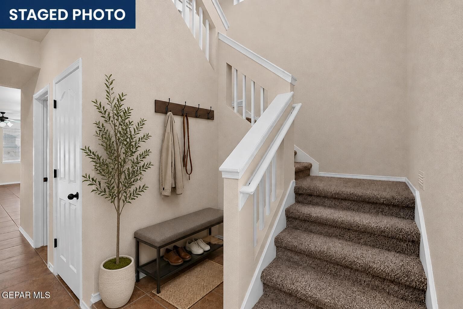 Virtually Staged niche space offers added functionality and can be used for seating, shoe storage, décor, organization, or other creative purposes.
