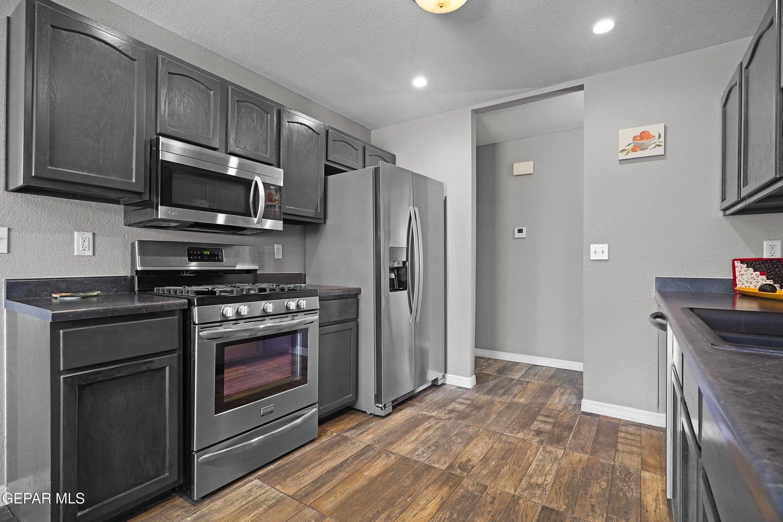 Repainted kitchen cabinets and new countertops