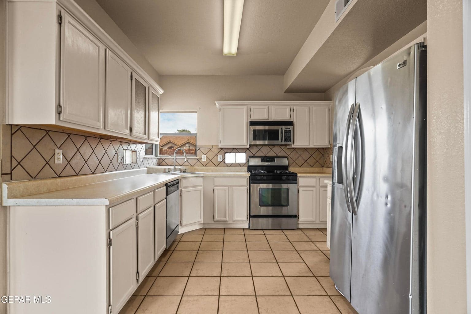 Tile flooring, ample cabinetry, and a practical layout
