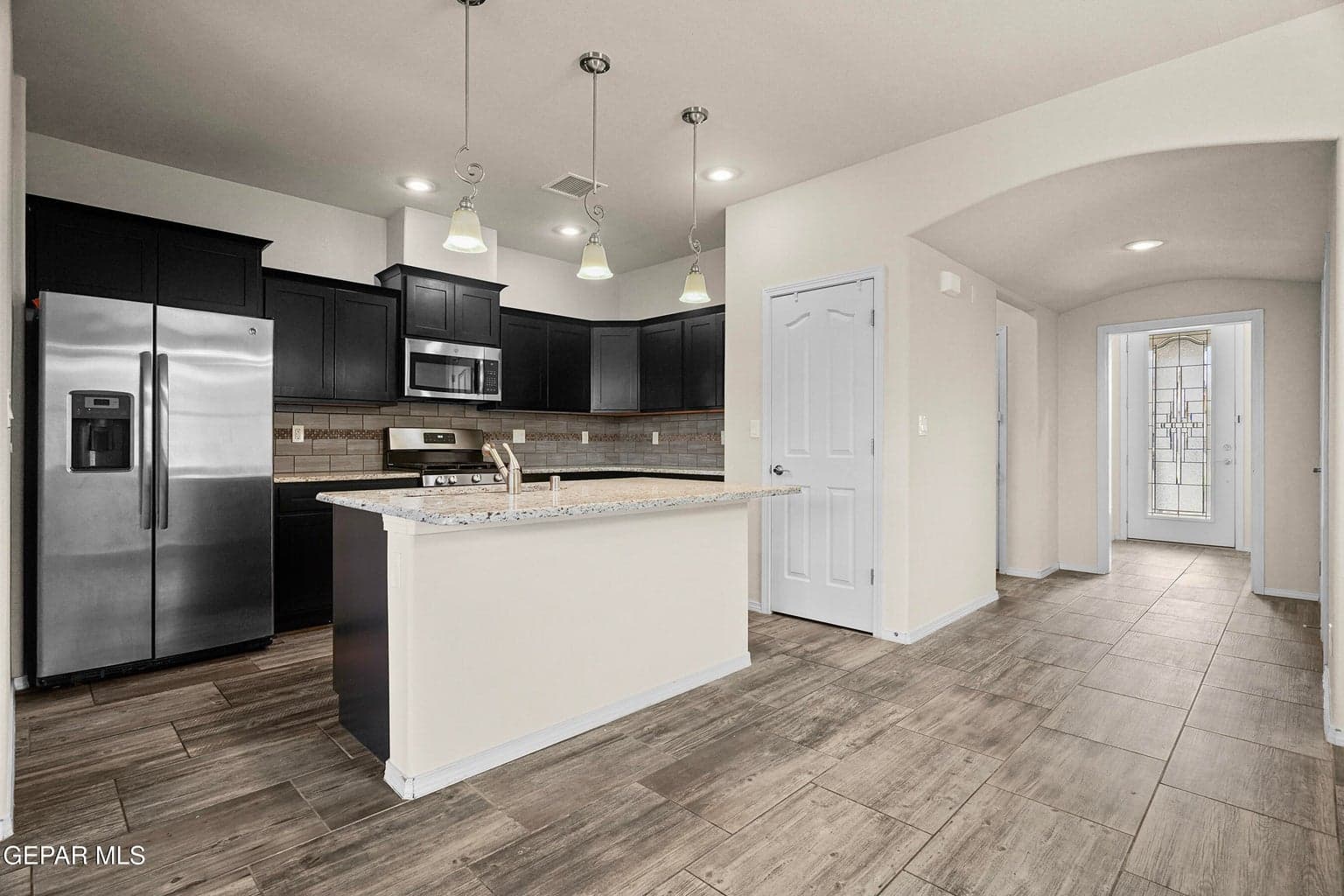 Fully equipped kitchen features granite countertops