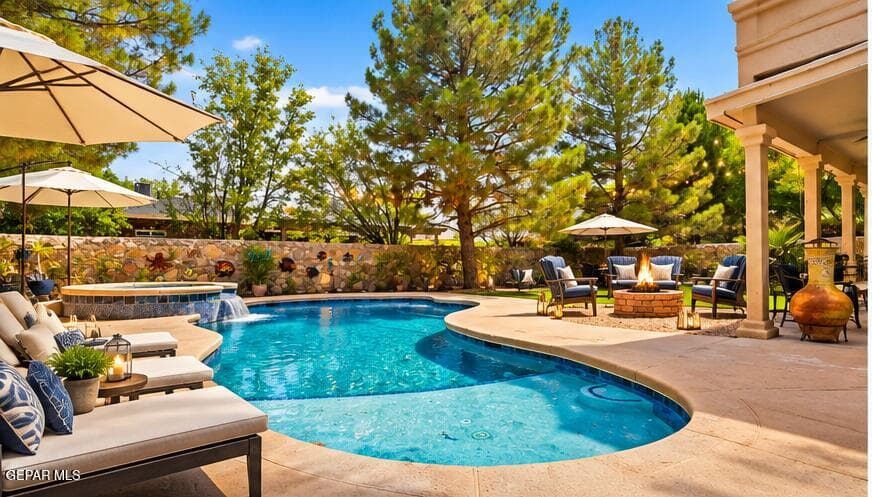 Salt Water Pool, Fire pit, Entertainers Dream! The pool is 6 ft deep at its deepest. The Baja shelf is 12 inches, and the shallow is 3 ft. It is Pebble based and there is an app that controls the lights, fountain, and heater.