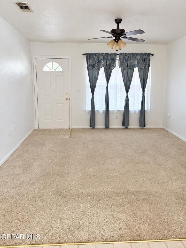 Spacious living area with an easy flow into the kitchen creating a comfortable space for everyday living.
