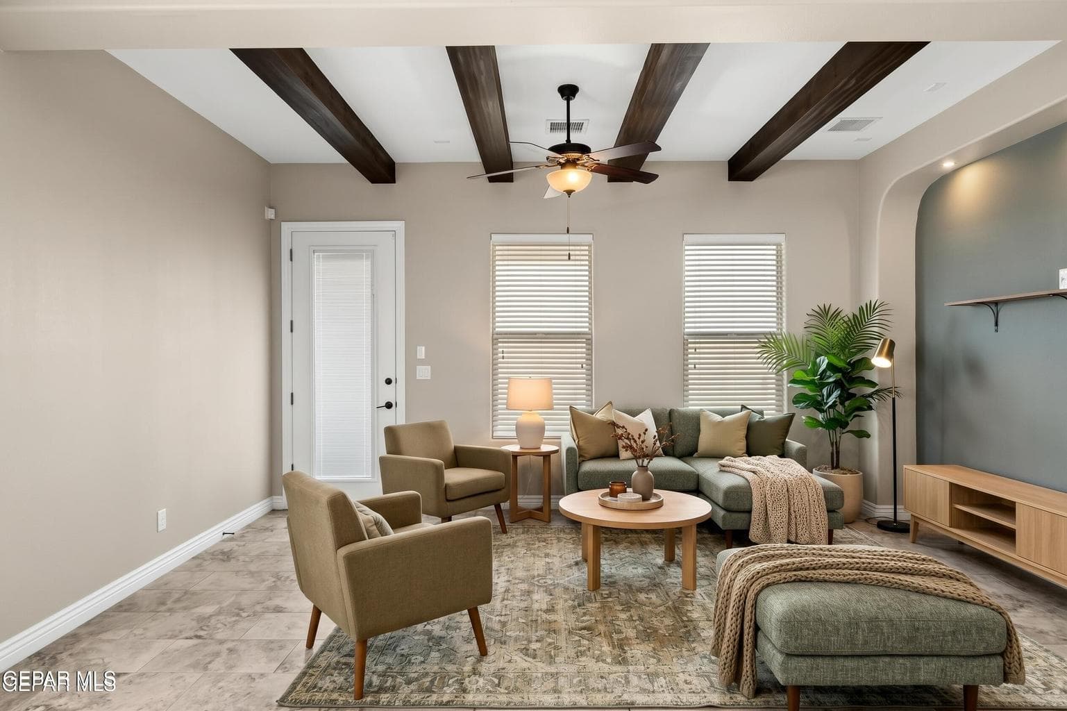 Tile flooring, decorative beams, and backyard access