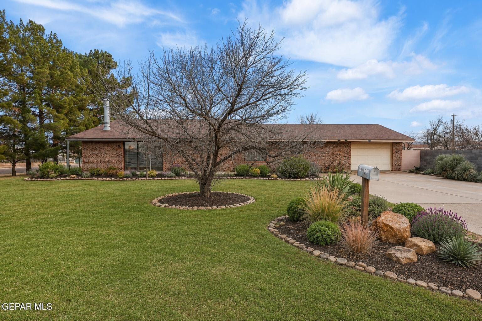With its spacious yard, mature trees and generous lot, this property offers plenty of room to create a welcoming outdoor space designed around your lifestyle-This image has been virtually enhanced to illustrate potential landscaping. Landscaping shown is not currently present and is for visualization purposes only.
