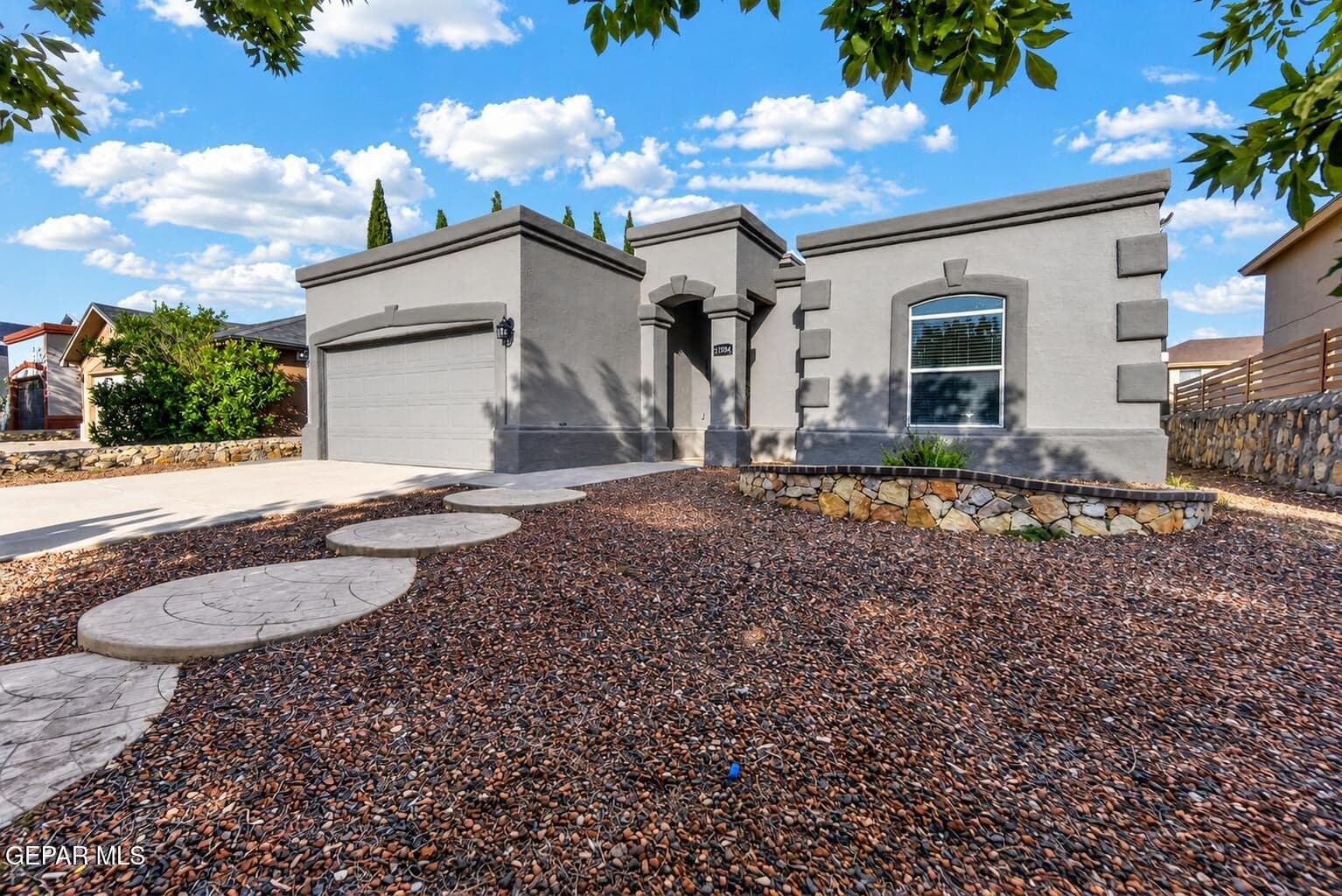 Modern Gray Stucco Home with Desert Land